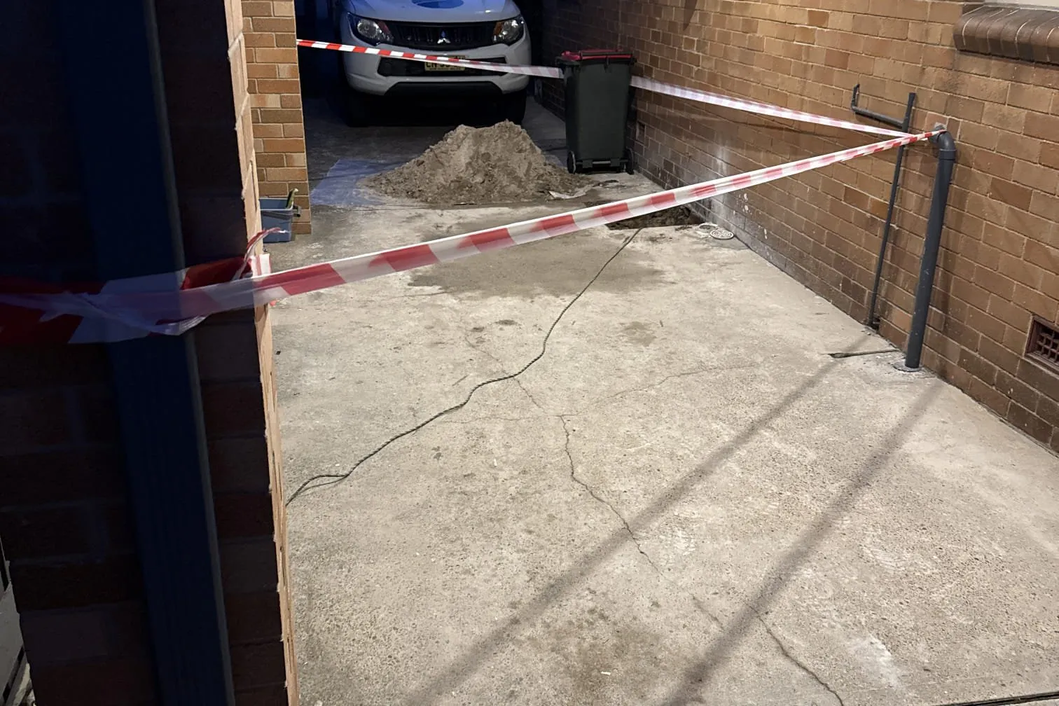 Carport taped off for drain works
