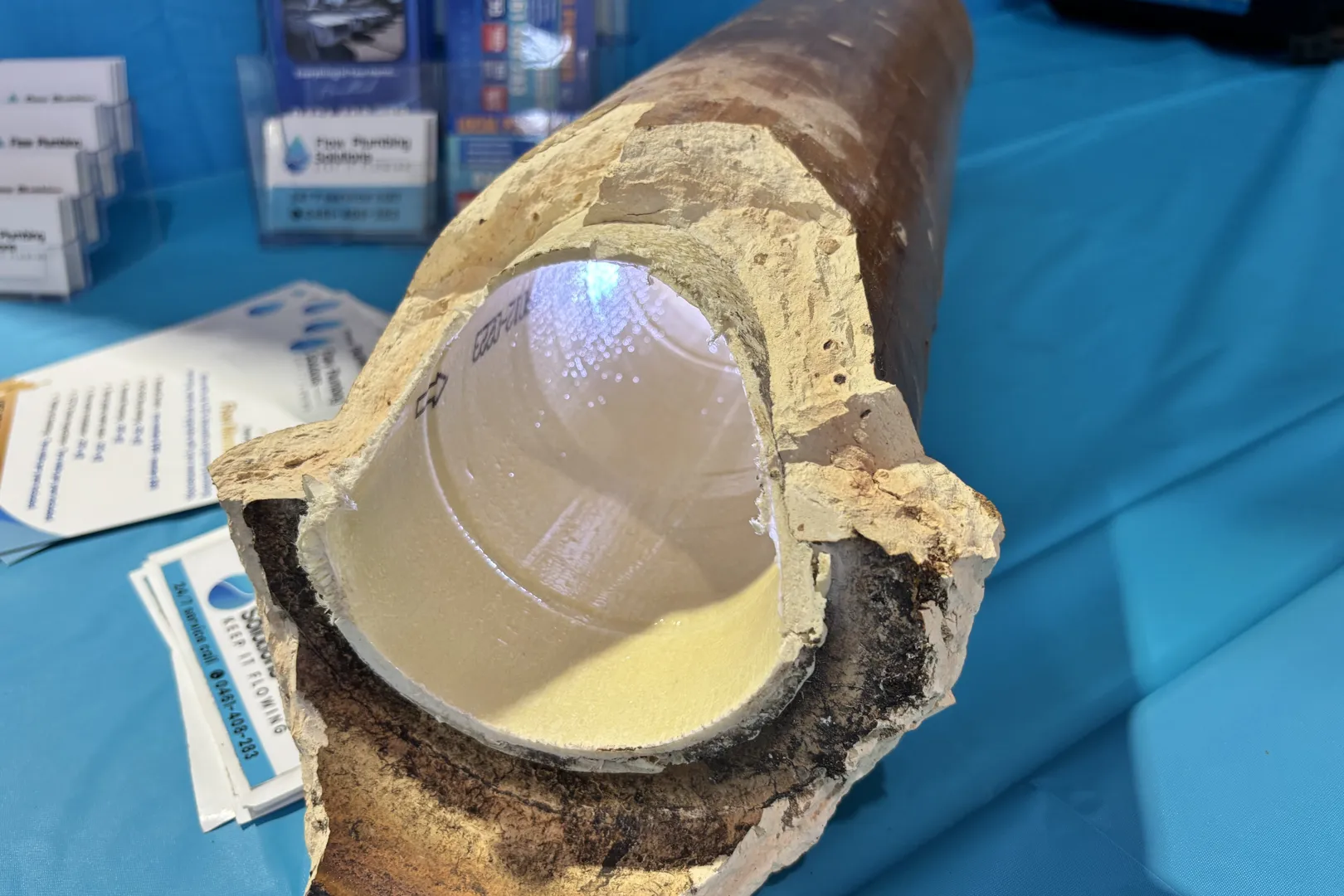 Cutaway of an old pipe with a cured-in-place liner inside