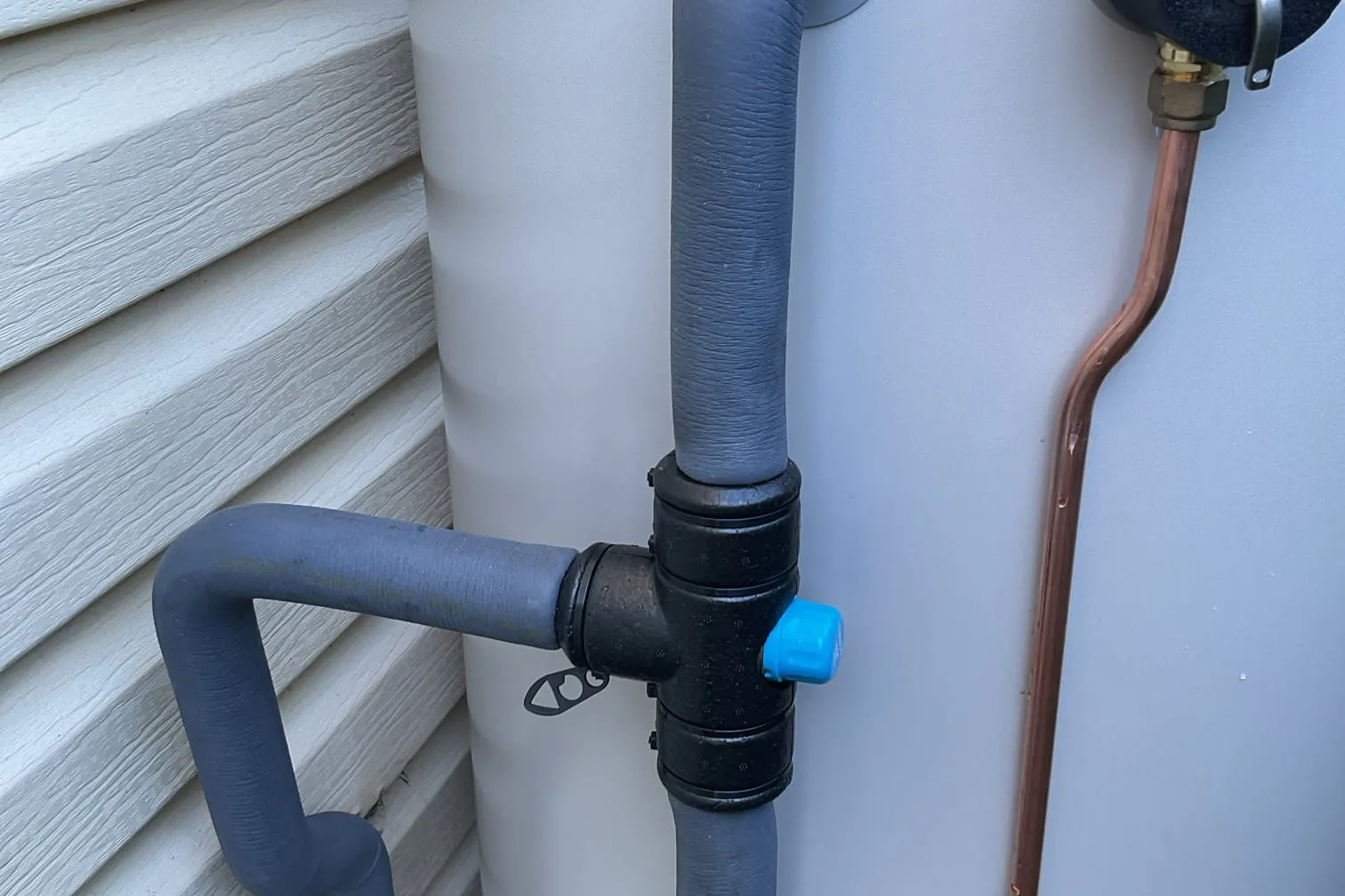 Close-up of hot water system pipework and valves