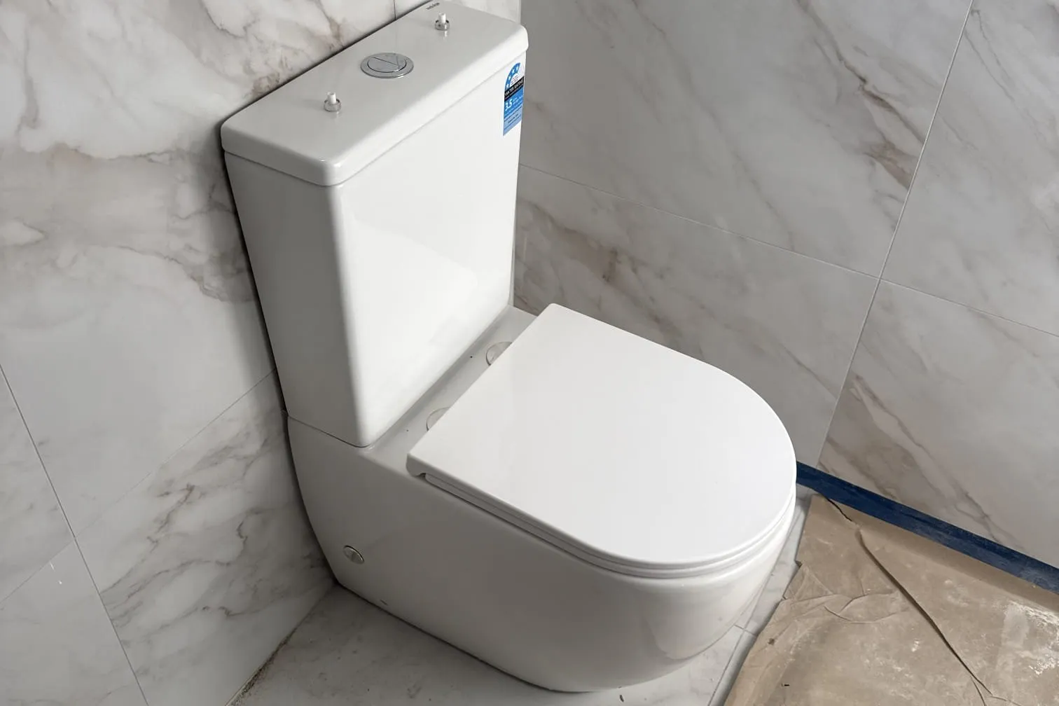 New toilet in a tiled bathroom