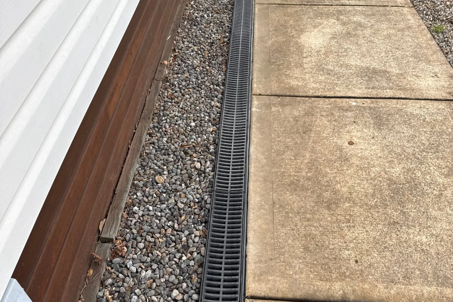 Strip drain between a house and a concrete path